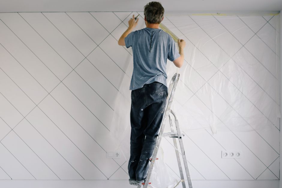 Professional house painters working as a team on exterior home painting project